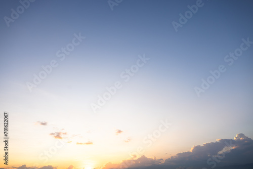 Beautiful sky and cloud at high. Include space, light of nature, sunset, sunrise. Colorful with yellow, orange and blue color at evening time in autumn for scene, backdrop, background and wallpaper.