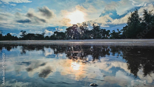 This is sunset at the beach in Pantai Anak Air Kuantan Pahang. This beautiful view was captured in the evening during cloudy day and a reflection of the sunset.
