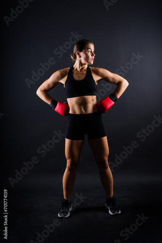 Young woman athletic female MMA fighter training. Concept of sport, action, healthy lifestyle.