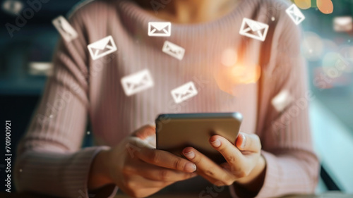 A woman is handling a smartphone, with email alert icons raised. The concept emphasizes the importance of online communication.