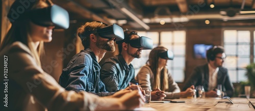 Business team using virtual reality headset in office meeting Developers meeting with virtual reality simulator around table in creative office. with copy space image. Place for adding text or design