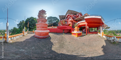 full hdri 360 panorama near hindu maruti temple of ape goddess hanuman on high mountain in jungle among palm trees in Indian tropic town in red color in equirectangular projection. VR AR content