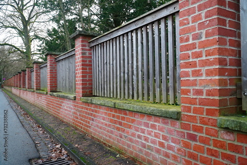Wall of red clinker bricks to border a monastery cemetery. Hanover Marienwerder, Lower Saxony, Germany.