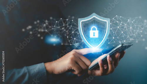 Digital shield icon, virtual icon, and hand pressing on it, scanning on mobile phone, verification identity and personal privacy ;Security cyber systems shield and data protection technology concept.