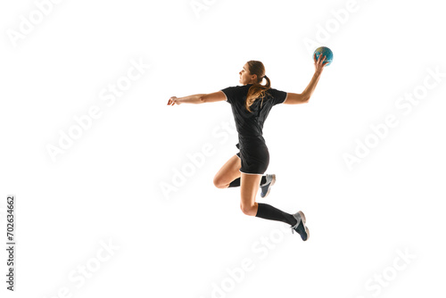 Fit young woman engaged in intense handball training, perfecting her throwing and catching abilities against white studio background. Concept of professional sport, movement, dynamic, championship. Ad