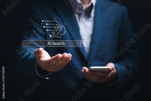Ai tech concept, businessman using smartphone with AI search engine bar for data search optimization by artificial intelligence technology.