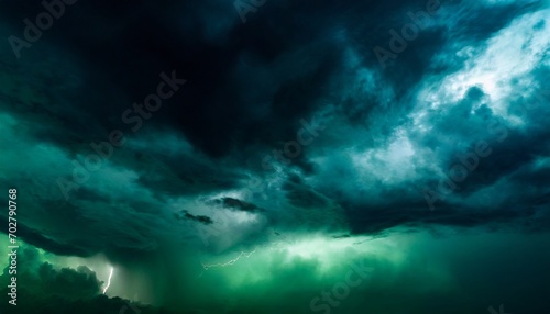 black dark greenish blue dramatic night sky gloomy ominous storm rain clouds background cloudy thunderstorm hurricane wind lightning epic fantasy mystic or creepy spooky nightmare horror concept