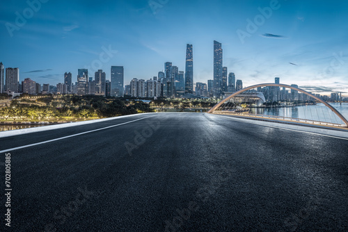 Empty asphalt road and city buildings landscape at night in Guangzhou