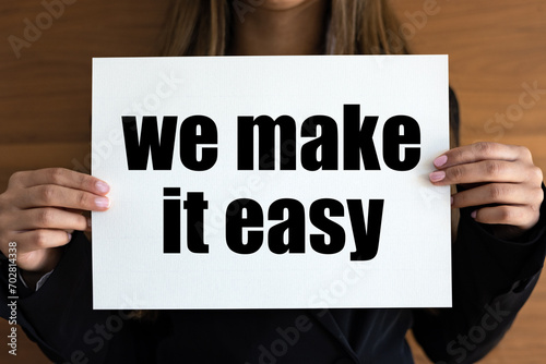 We make it easy. Woman with white page, black letters. Easy goinng, motto, slogan, cool attitude.