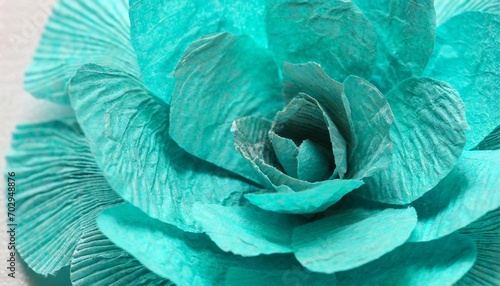 fragment of a turquoise flower made of crepe paper macro photography