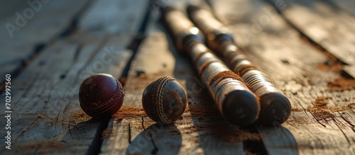 Cricket equipment on wooden surface.