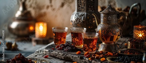 Focus on traditional Arabic tea and dried fruits.