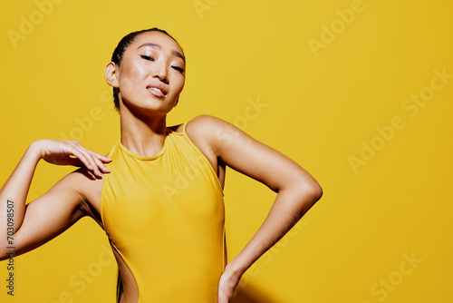 Woman trendy face beauty yellow summer surprised smile fashion attractive swimsuit portrait