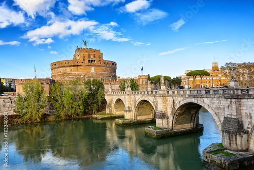 Castel Sant'Angelo and the Sant'Angelo bridge over Tiber river during sunny day in Rome, Italy.