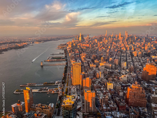 Aerial panoramic view over New-York skyline and Hudson river from One World Observatory deck at One World Trade Center, Winter Sunset