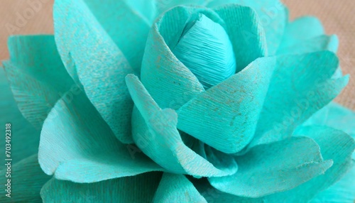 fragment of a turquoise flower made of crepe paper macro photography
