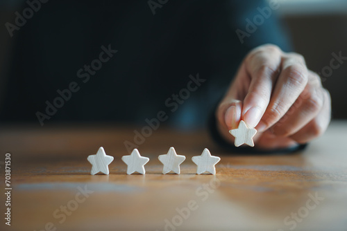 Customer Experience Concept. Man hand showing on five star excellent rating on background, copy space 