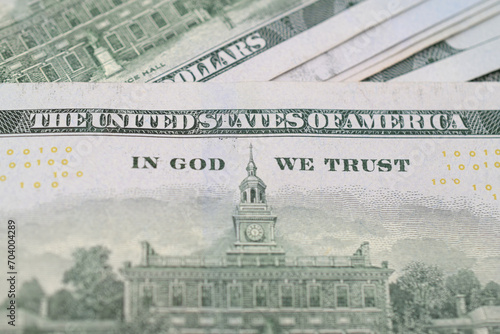 Close up of "In God We Trust" on American hundred dollar bills