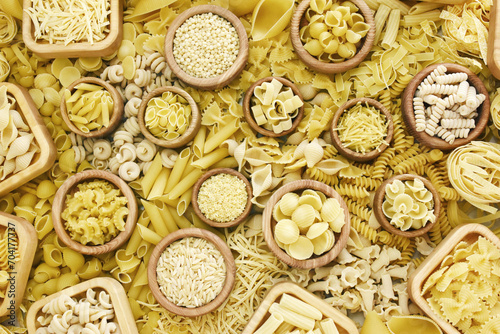 Mix of pasta shapes varieties: penne and fusilli, farfalle and macaroni, rigatoni and rotini, rigate and conchiglie