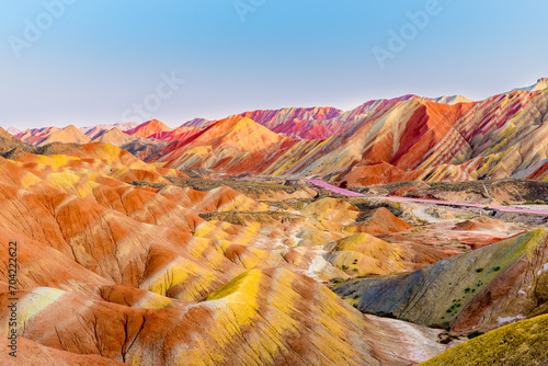 Amazing scenery of Rainbow mountain and blue sky background in sunset. Zhangye Danxia National Geopark, Gansu, China. Colorful landscape, rainbow hills, unusual colored rocks, sandstone erosion