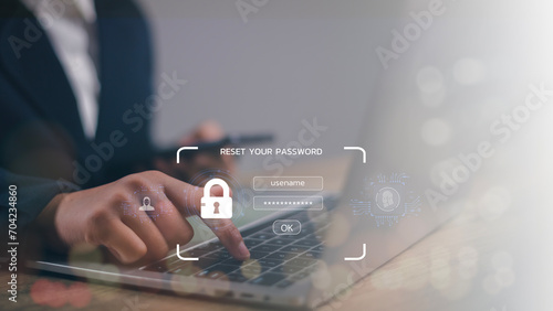  A lock icon, and security code show on the change password page while a business person using a laptop computer. Cyber security technology on websites or apps for data protection.