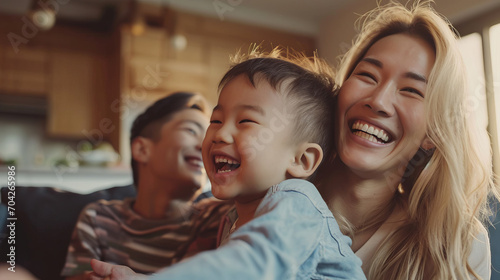 Portrait of a Korean family with parents and their young toddler kid at happy home