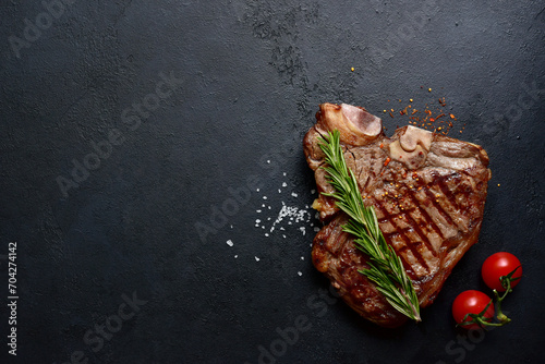 Grilled T-bone beef steak. Top view with copy space.