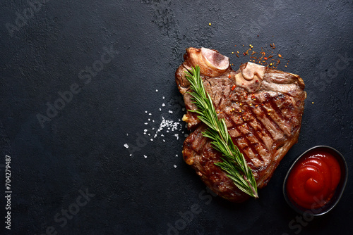  Grilled T-bone beef steak. Top view with copy space.