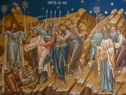 The painting on the wall representing the kiss of Judas. Judas kissing Jesus, the icon painted on the walls of the Petru Voda monastery - Romania