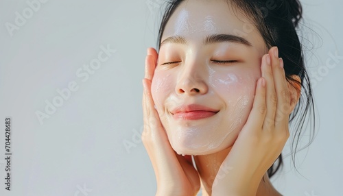 portrait of a woman cleaning her face