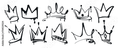 Set of graffiti spray painted crowns. Black brush paint king crown isolated on white background. Hand drawn street art vector illustration. Grunge airbrush drawing, inky elements with splashes.