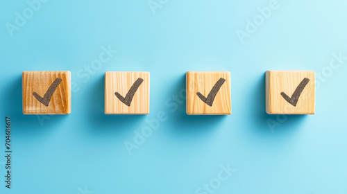 Checklist concept with copy space. Wood cubes with check marks on blue background.