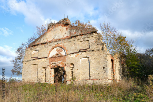 The ruins of the ancient Lutheran church of the Holy Apostles Peter and Paul (1798) in the Malye Gorki village on a sunny October day. Leningrad region, Russia