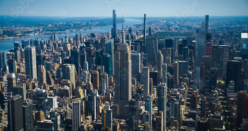 New York City Skyline During Day Time. Aerial Footage from a Helicopter. Empire State Building with Other Famous Urban Landmarks and Skyscraper Buildings. Modern Concrete Jungle Architecture