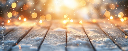 A wooden table dusted with snow against a backdrop of warm, glowing bokeh lights, evoking a festive winter scene.