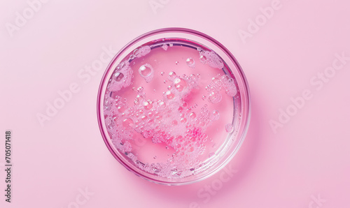 violet serum droplets in petri dish