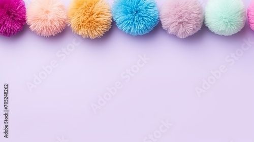 A set of colorful pom-poms with a high angle and copy space.