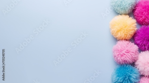 A set of colorful pom-poms with a high angle and copy space.