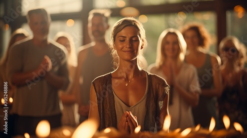 A group of diverse people praying together in a yoga studio