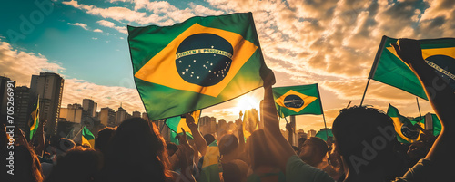 people waving brazilian flag at event