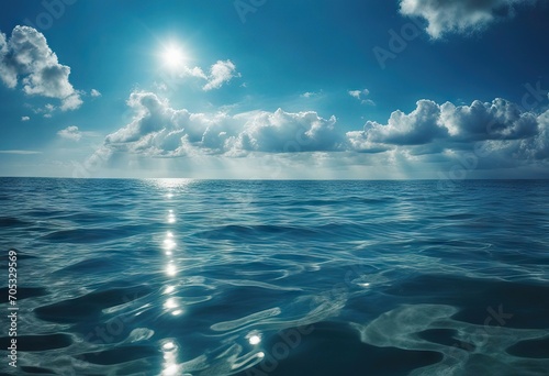 Blue sea or ocean water surface and underwater with sunny and cloudy sky stock photoSea Water Water Surface Underwater