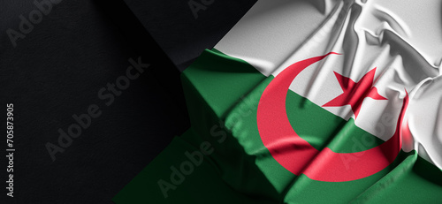 Flag of Algeria. Fabric textured Algeria flag isolated on dark background. 3D illustration