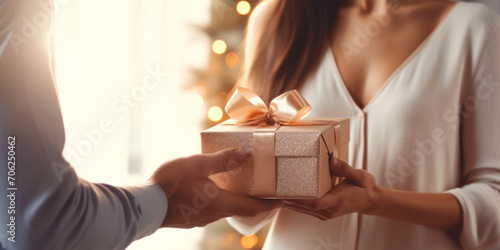 close up of gold luxury gift box in hands, man is giving present to woman, concept of romantic loving couple in relationships, happy valentine day, celebrate international women's, easter surprise gif