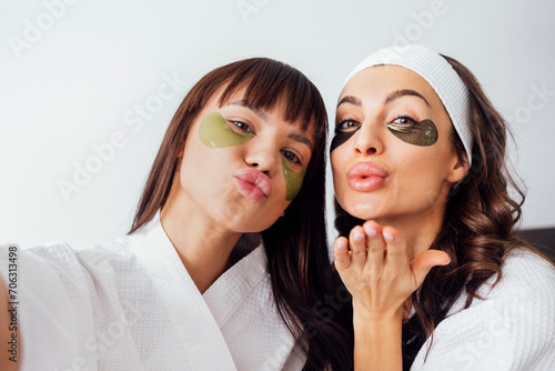 Mother and teen daughter have beauty day togather, making selfi