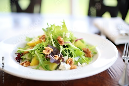 fig and walnut salad with goat cheese on mixed greens