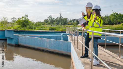 Environmental engineers work at wastewater treatment plants,Water supply engineering working at Water recycling plant for reuse,Technicians and engineers discuss work together.