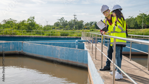 Environmental engineers work at wastewater treatment plants,Water supply engineering working at Water recycling plant for reuse,Technicians and engineers discuss work together.