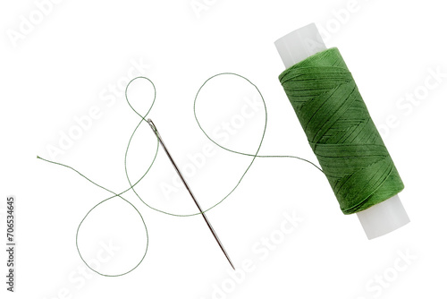 Old spool of thread and needle on a white background. Sewing accessories