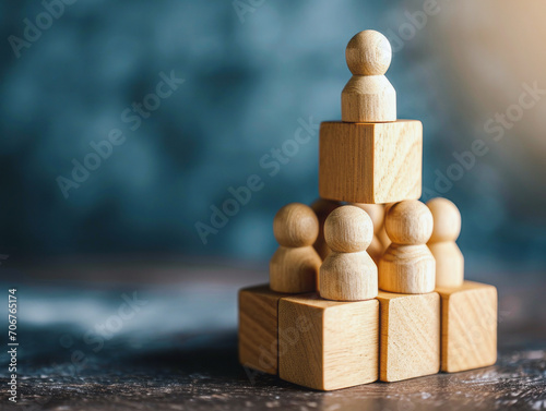 Human resources, corporate hierarchy concept and multi-level marketing - complete team of recruiters represented by wooden cubes.