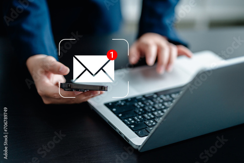 Businesswomen using smartphones check New email notifications and business digital online marketing. Inbox receiving electronic message alert. icon envelope virtual screen, communication technology.